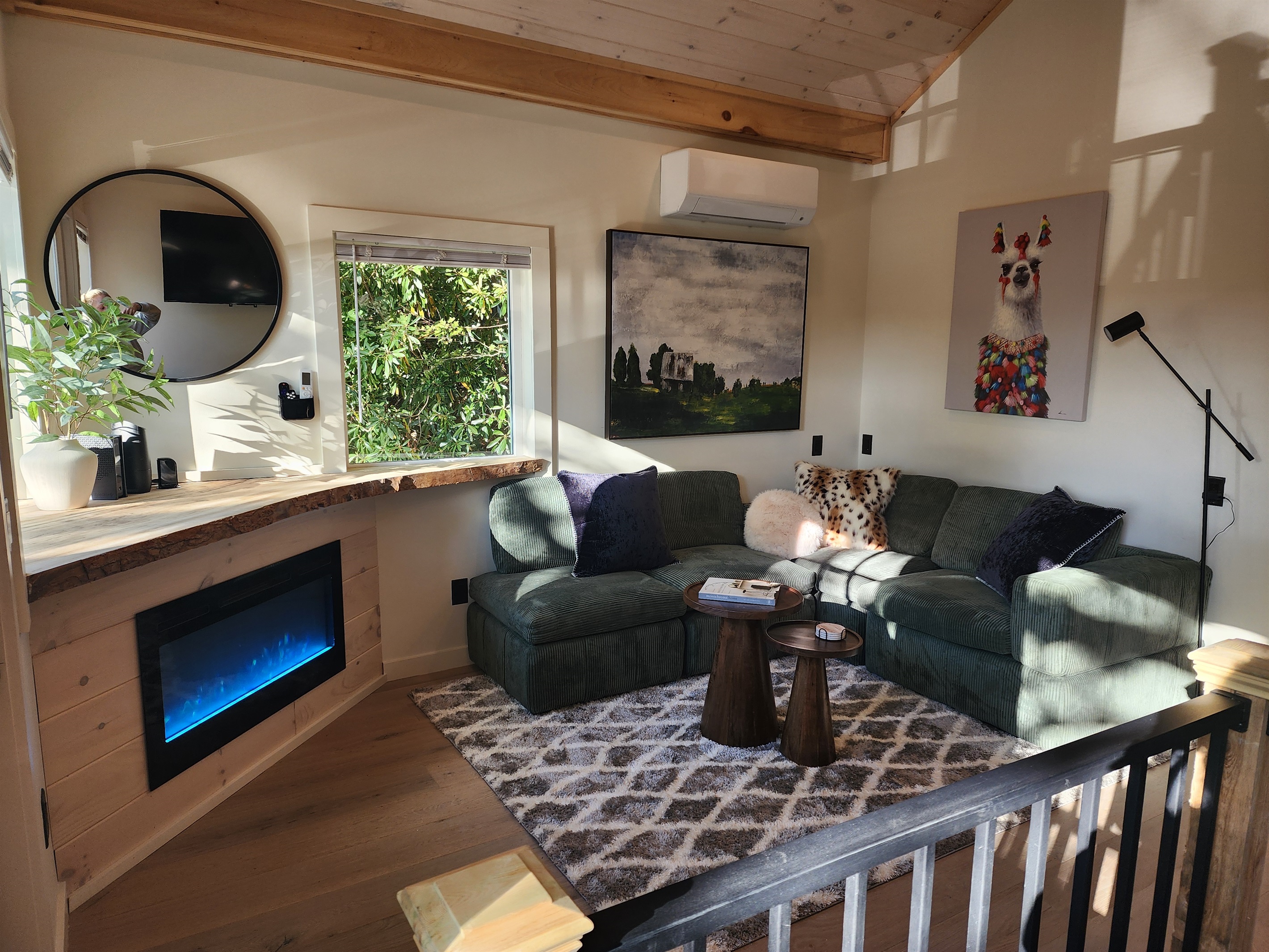 Cozy Living Room with 55-inch Smart TV, Fireplace, and bistro table.