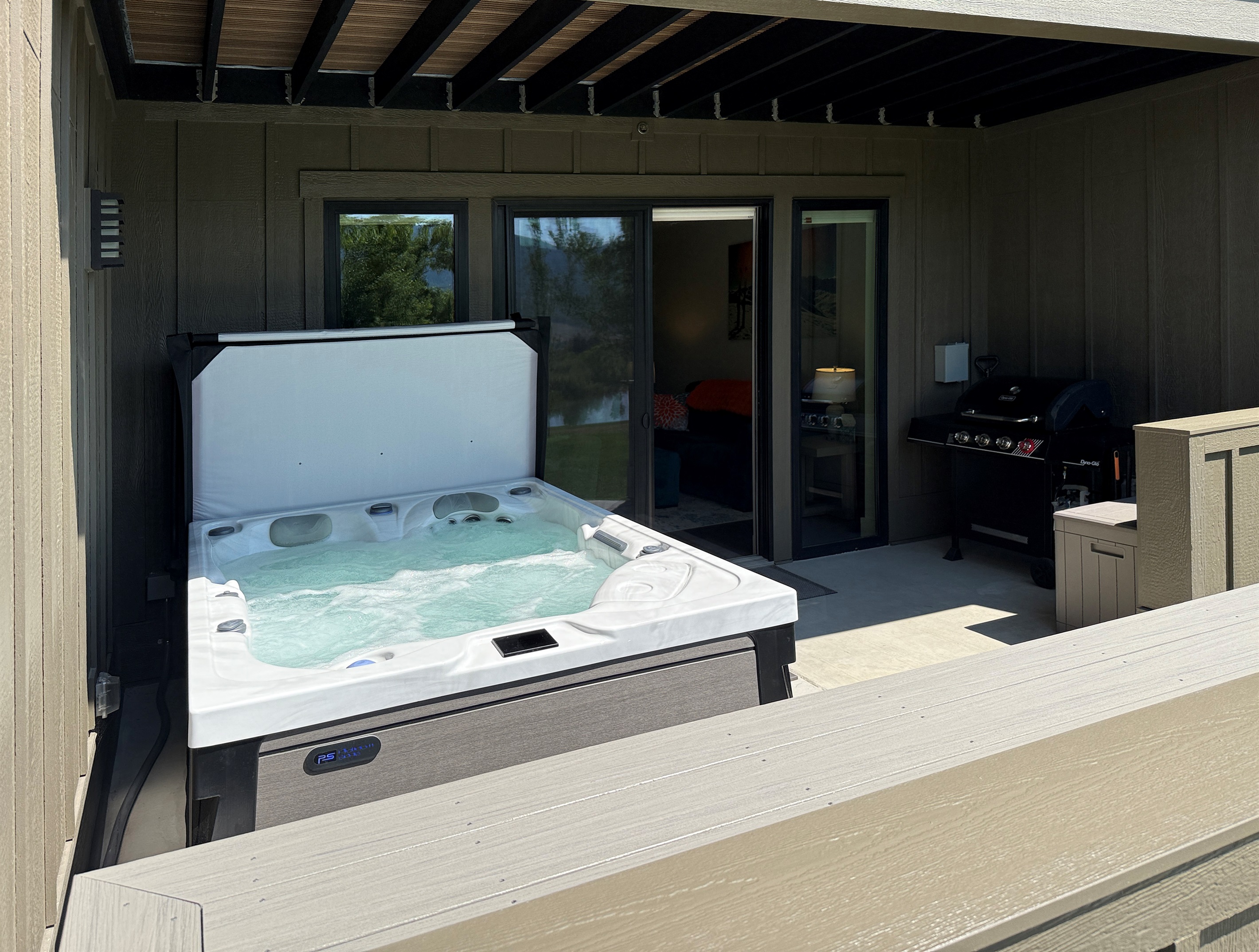 Relax  with family and friends on the partially covered deck, just outside the main living area.