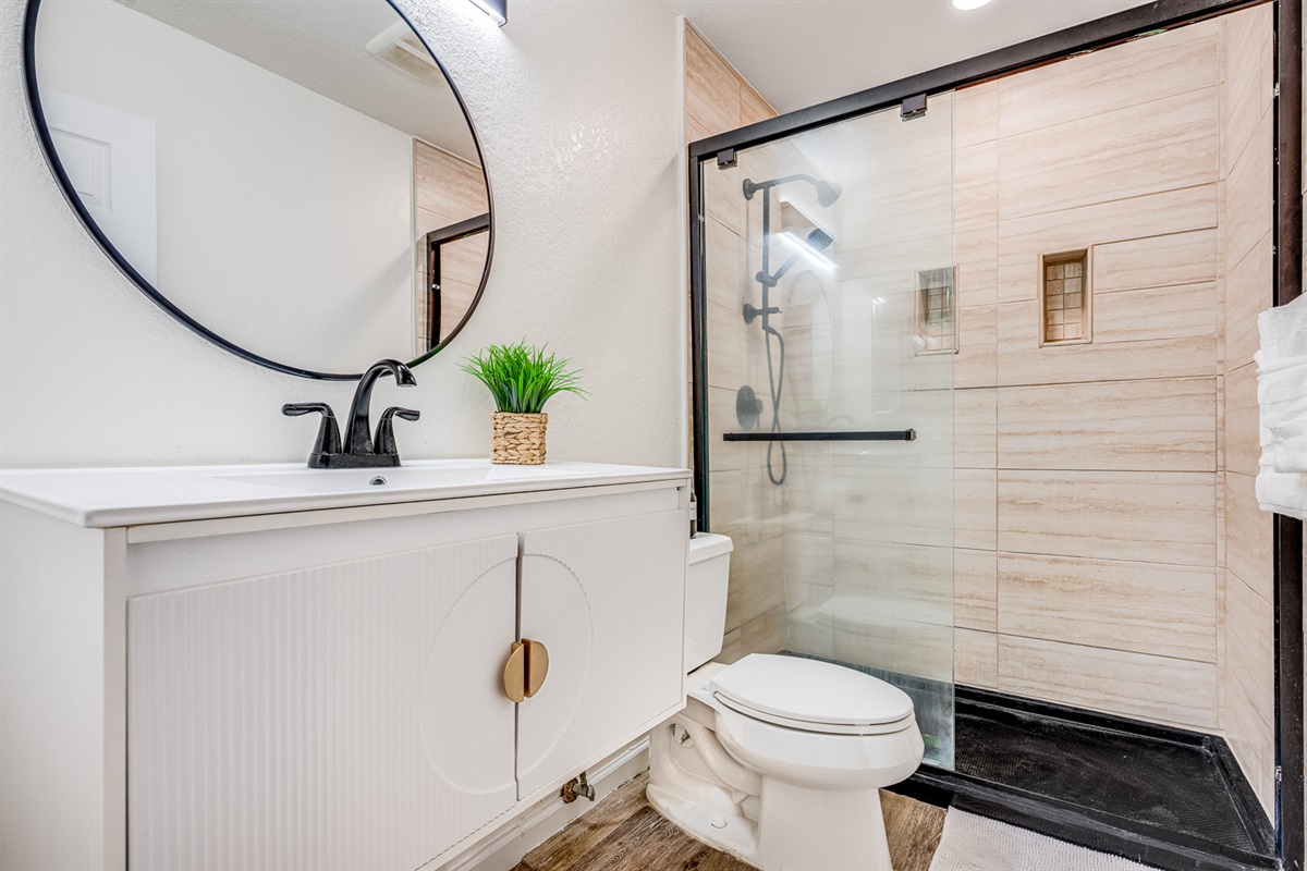 Elegant, modern bathroom with walk-in glass shower