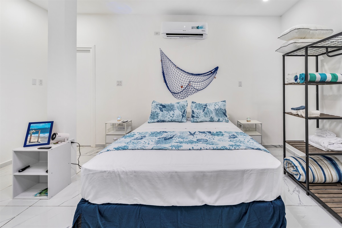 Close-up of marine-themed bed with open storage shelves