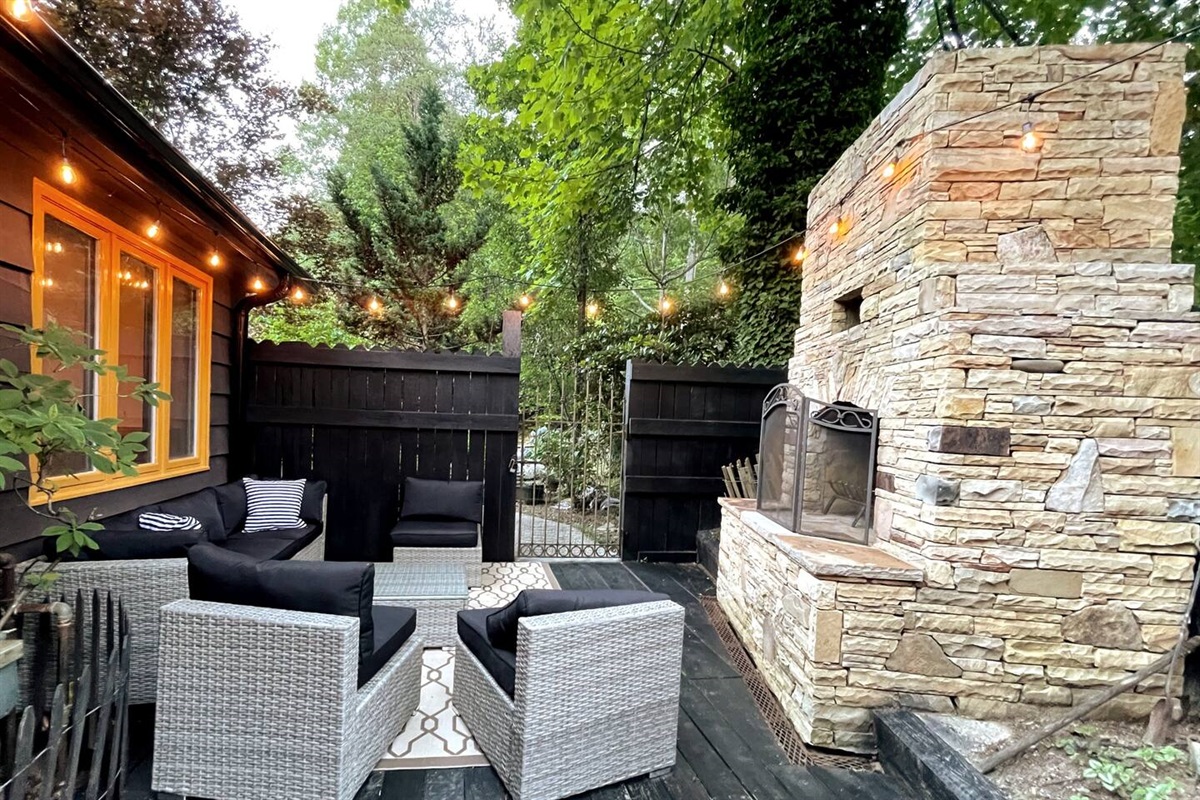 Cozy Outdoor Stone Fireplace with Patio Seating on the Deck—Perfect for Relaxing & Enjoying Mountain Life!