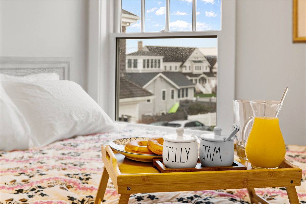 Comfort and calm await in the second bedroom with a queen bed and soft linens.