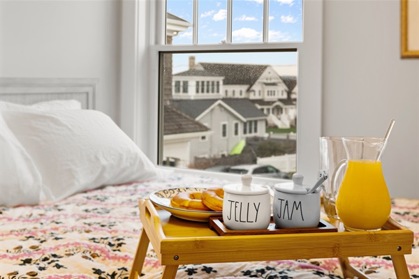 Comfort and calm await in the second bedroom with a queen bed and soft linens.