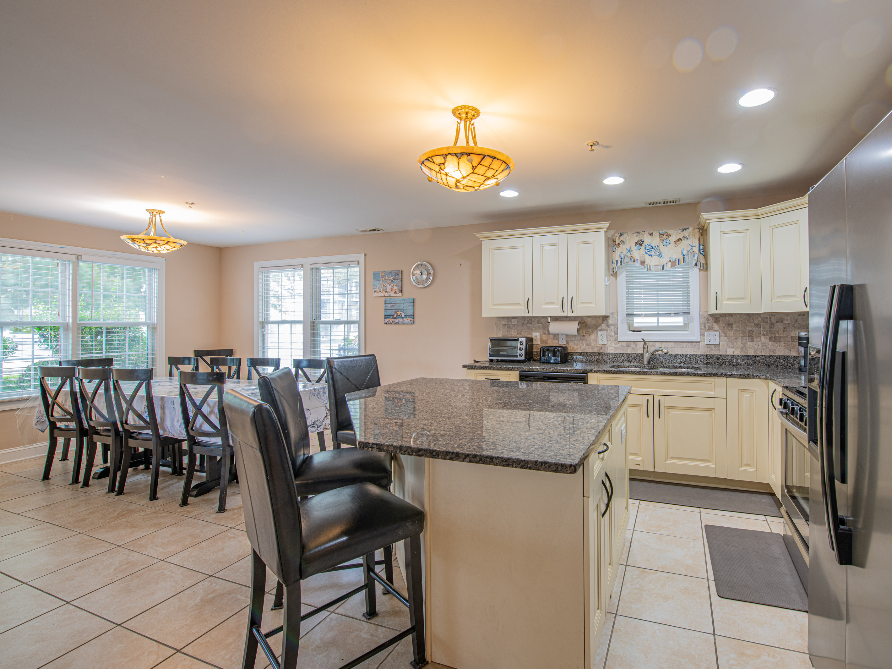 Fully Equipped Kitchen with Granite Countertops, Island, and Breakfast Bar Seating