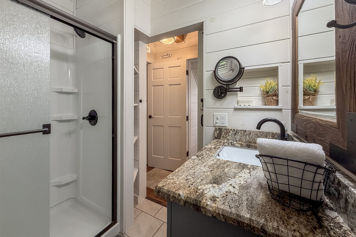 Full bath with a stand-up shower, and convenient for all to access.