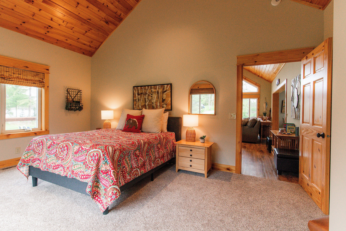Spacious queen bedroom with gorgeous high ceilings.