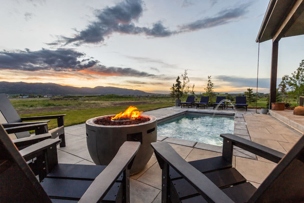 Heated pool, fire pit, and stunning sunset views—the perfect place to unwind after a day of adventure.