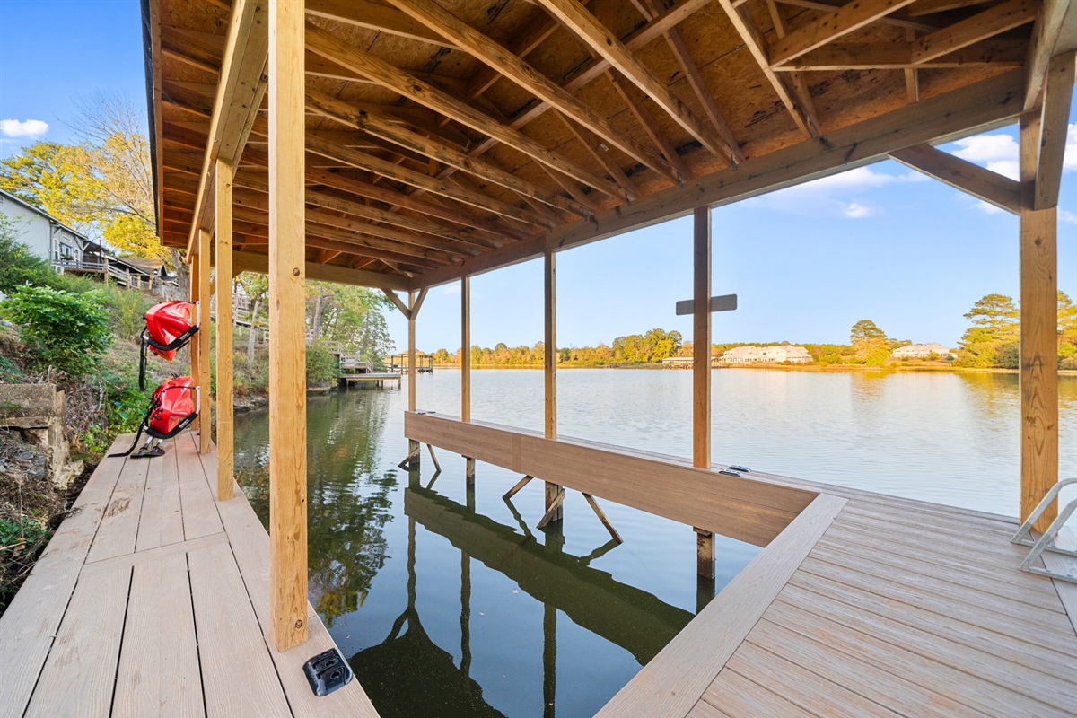 Large enough to accommodate a ski boat or barge, this dockside spot is perfect for quiet moments by the lake. Relax, enjoy the view, and let the calmness of the water wash over you.