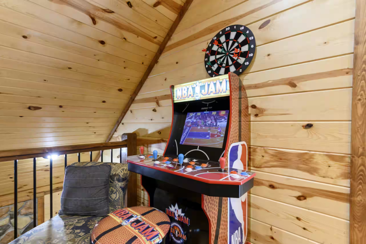 Game Room: Challenge friends to NBA Jam on this retro arcade while surrounded by stunning wood accents!