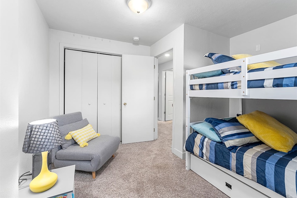 Lower level Bedroom 3. Full size bunk beds w/ trundle & single pullout chair! 