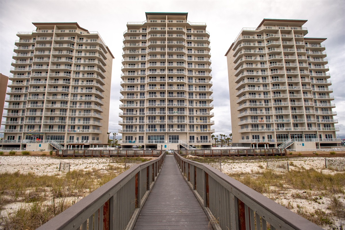 Summerwind Resort as seen from the Gulf. Large boardwalk, leads to the ocean.