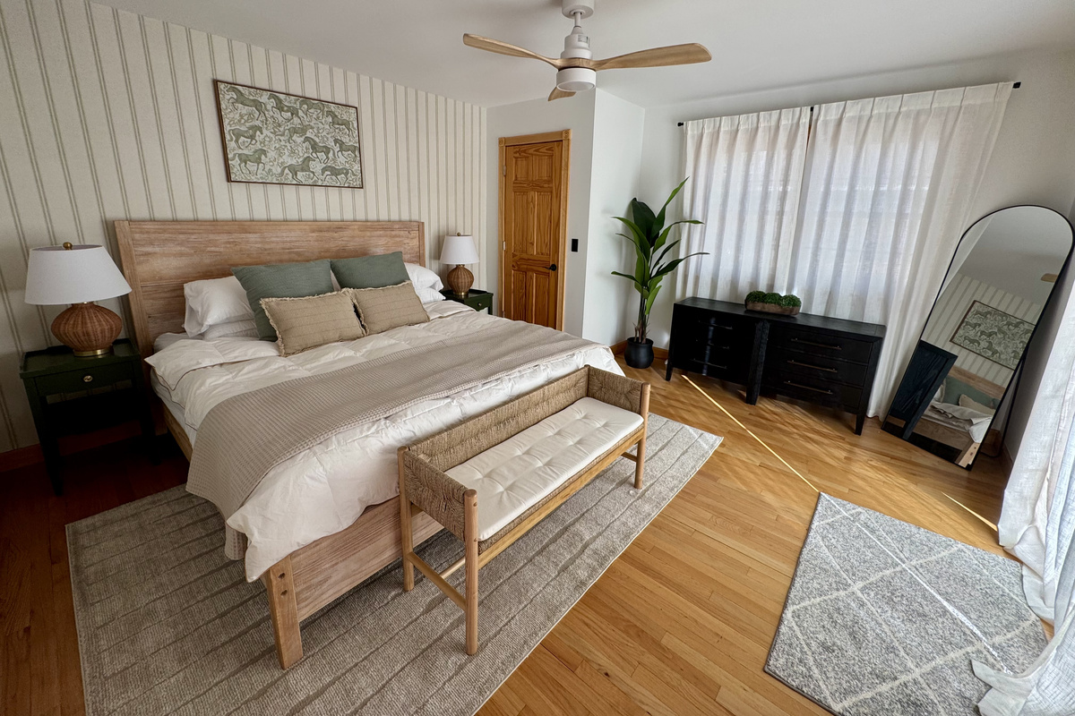 Secondary suite with king bed and riverfront ambiance