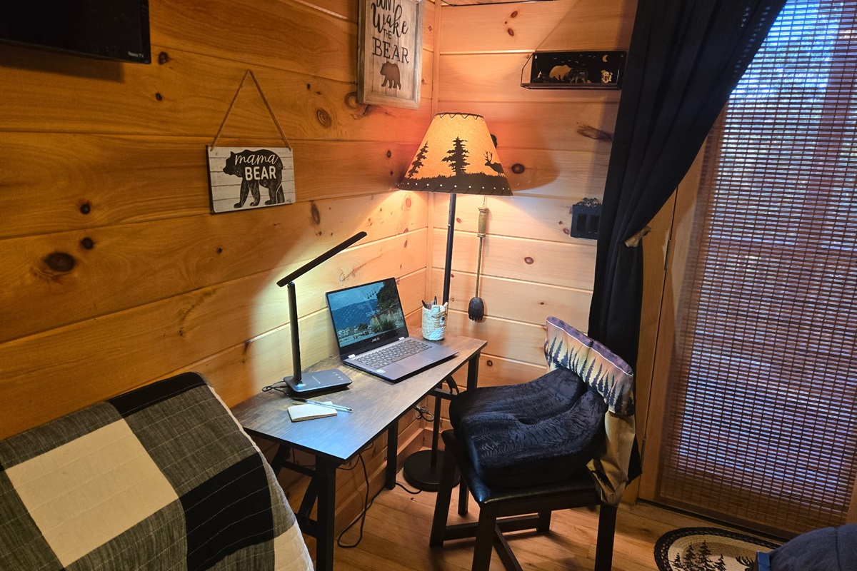 dedicate workspace has desk that can be easily folded up and moved to other rooms depending on who has work to do