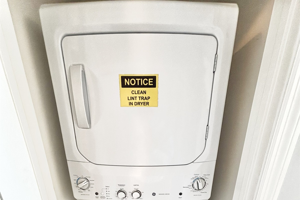 Stacked washer/dryer in hallway closet