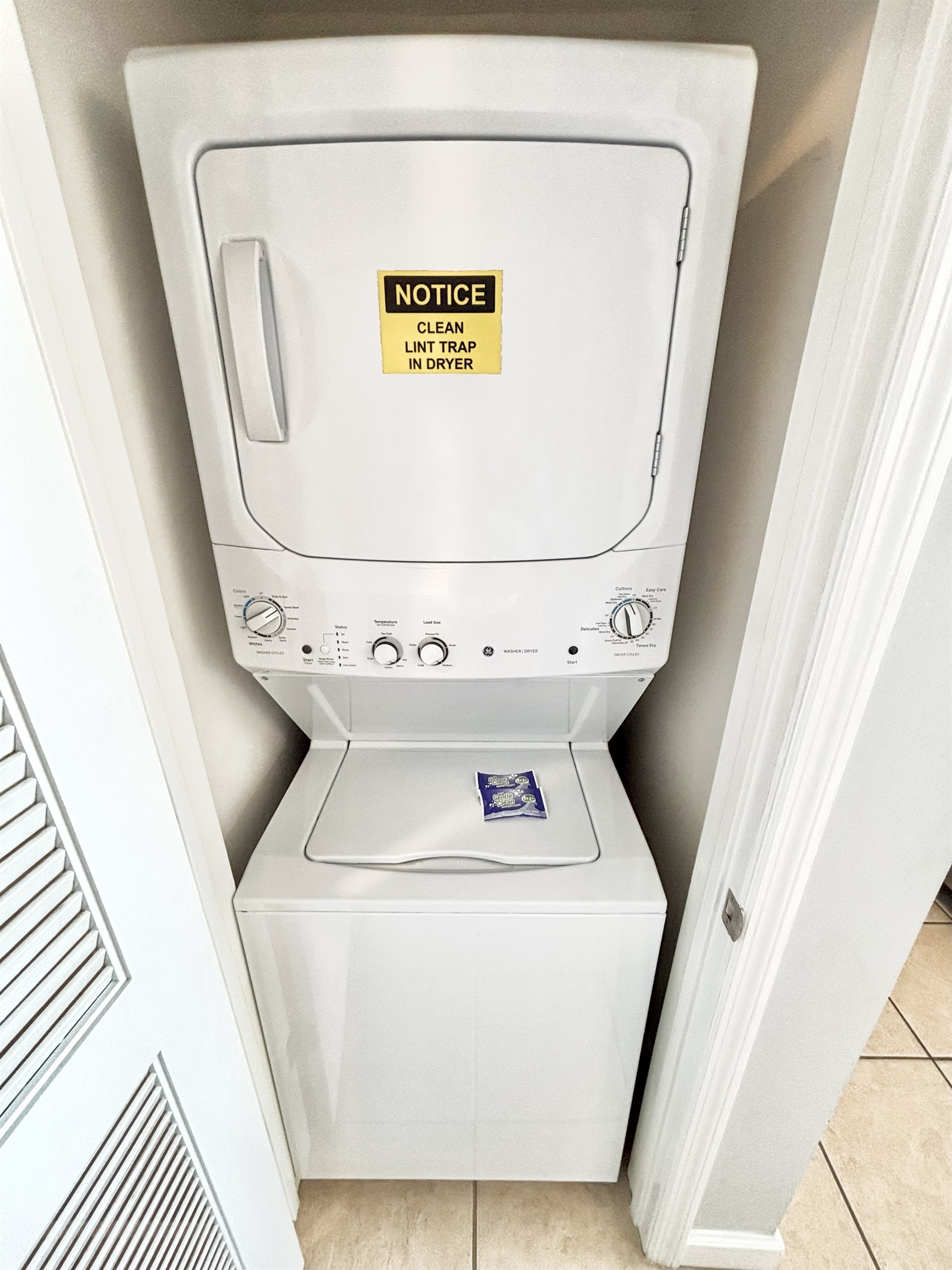 Stacked washer/dryer in hallway closet
