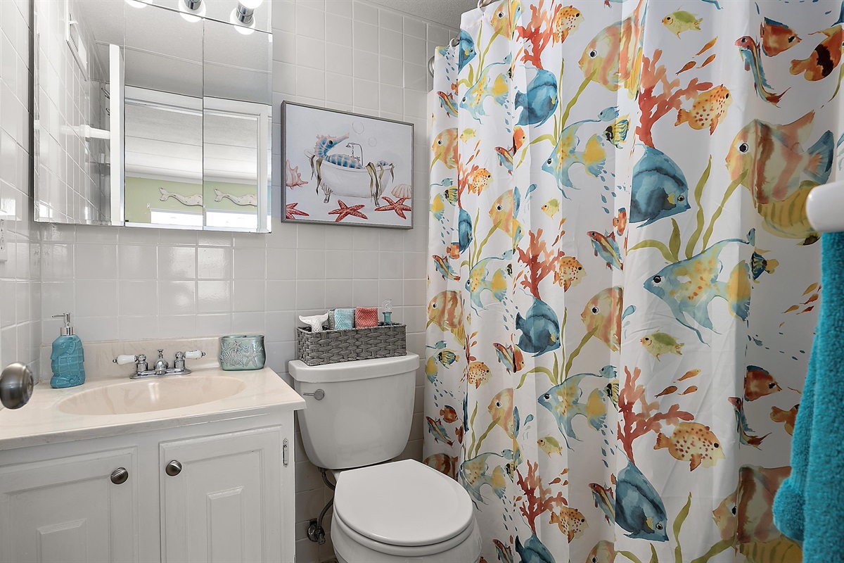 The ensuite bathroom with a shower/tub combination is the perfect place to refresh after a day in the sun.