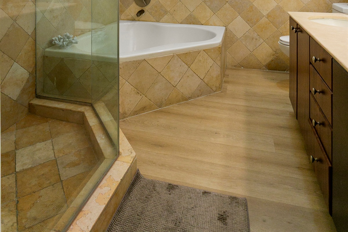Primary Suite en-suite with separate tub and walk-in shower, double-sink vanity