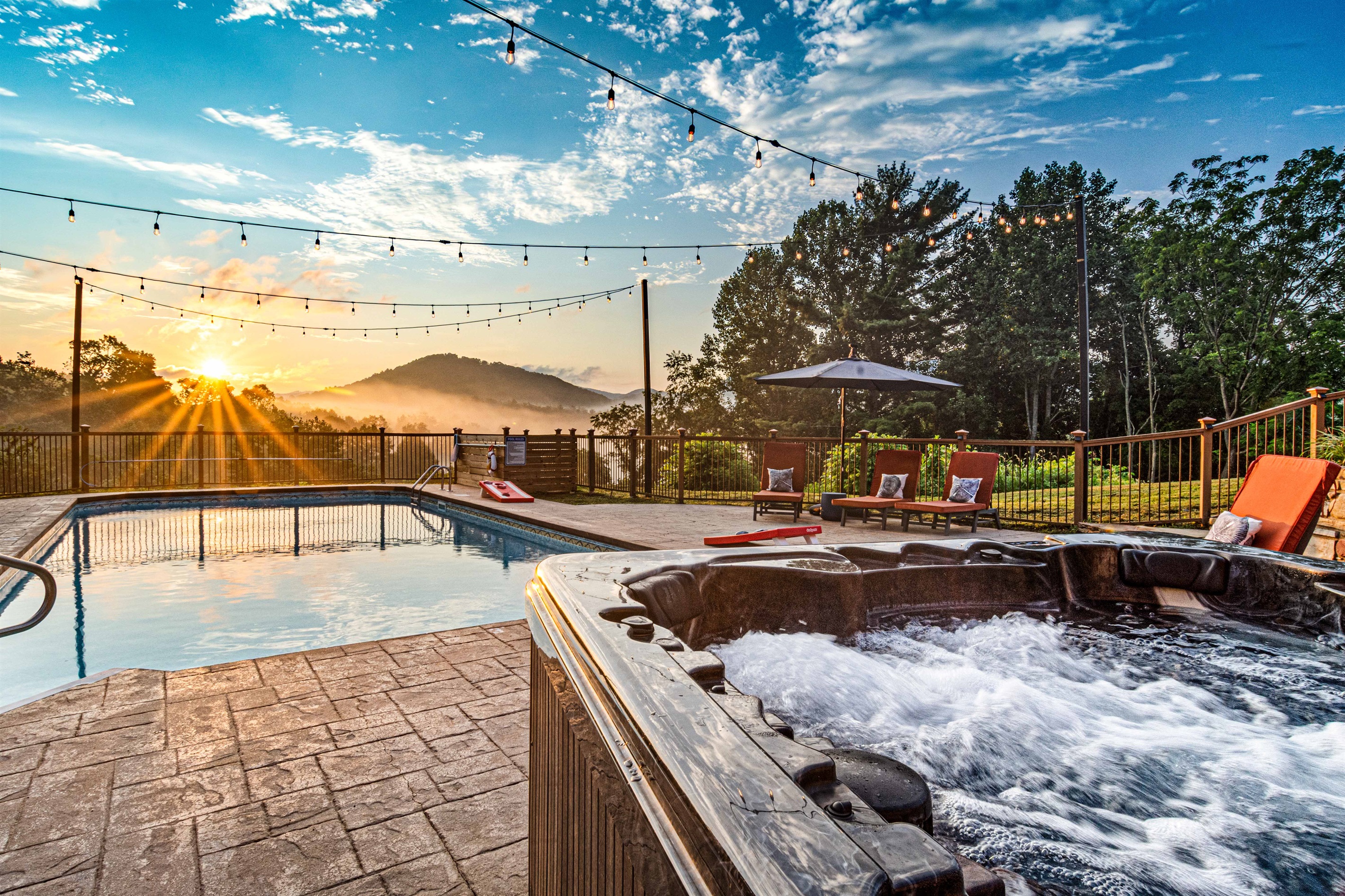 Watch the sun rise over the mountains from the hot tub or pool—string lights overhead and lounge chairs waiting for you to start the day in pure relaxation. 🌅💦