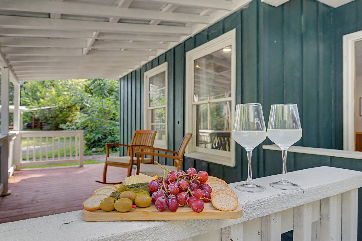 Porch Paradise: Sip drinks and savor snacks while soaking in lush, peaceful surroundings!