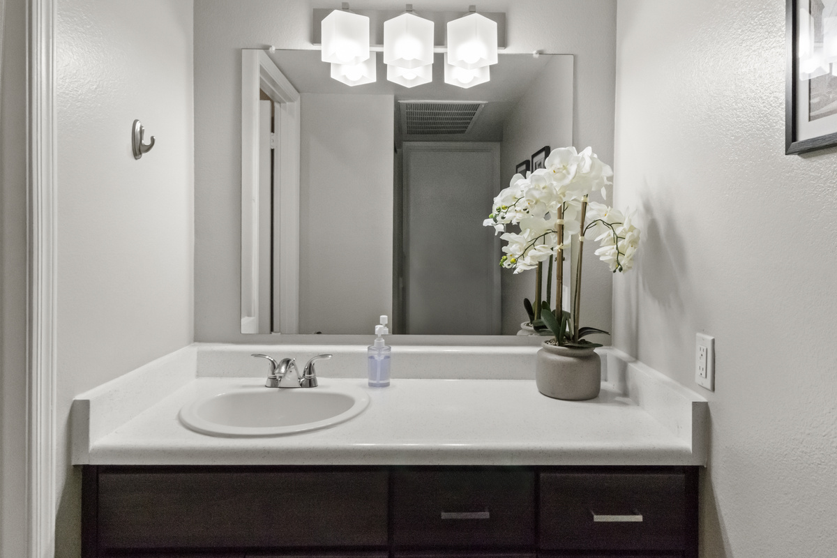 Comfortable bathroom space with a convenient mirror for your daily routine.