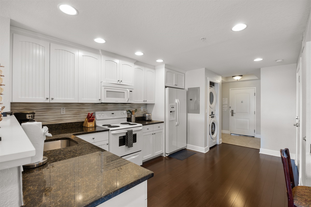 Kitchen, fully stocked with cooking/eating/drinking utensils