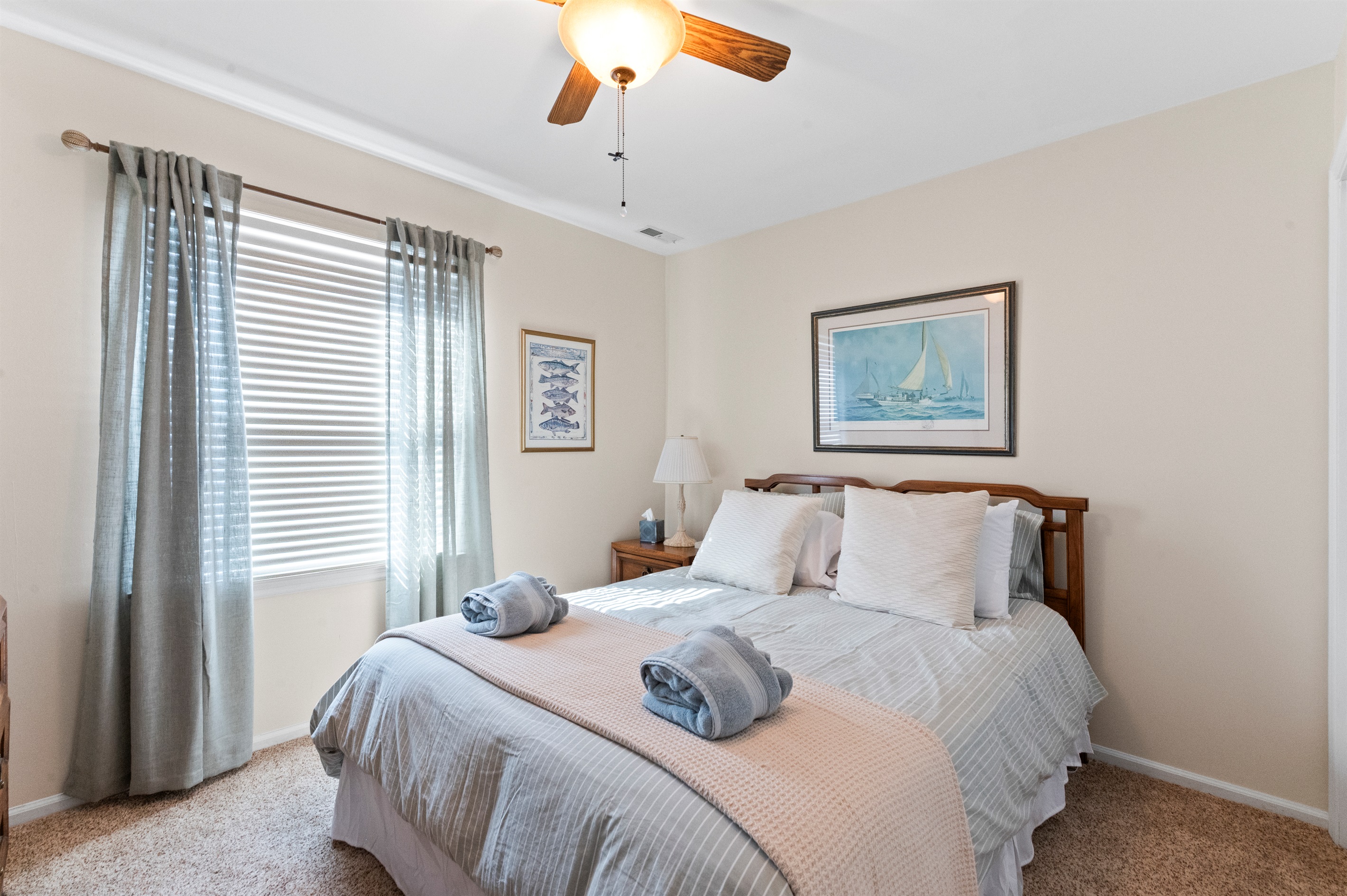 Bedroom Queen 2: Relax in this bright room with nautical decor and a serene ambiance!