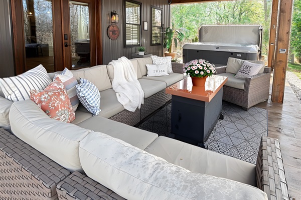 Relax and unwind in our stylish outdoor living space, complete with cozy seating and a hot tub! Enjoy serene moments surrounded by nature, perfect for stargazing or sipping your morning coffee. Your getaway awaits!