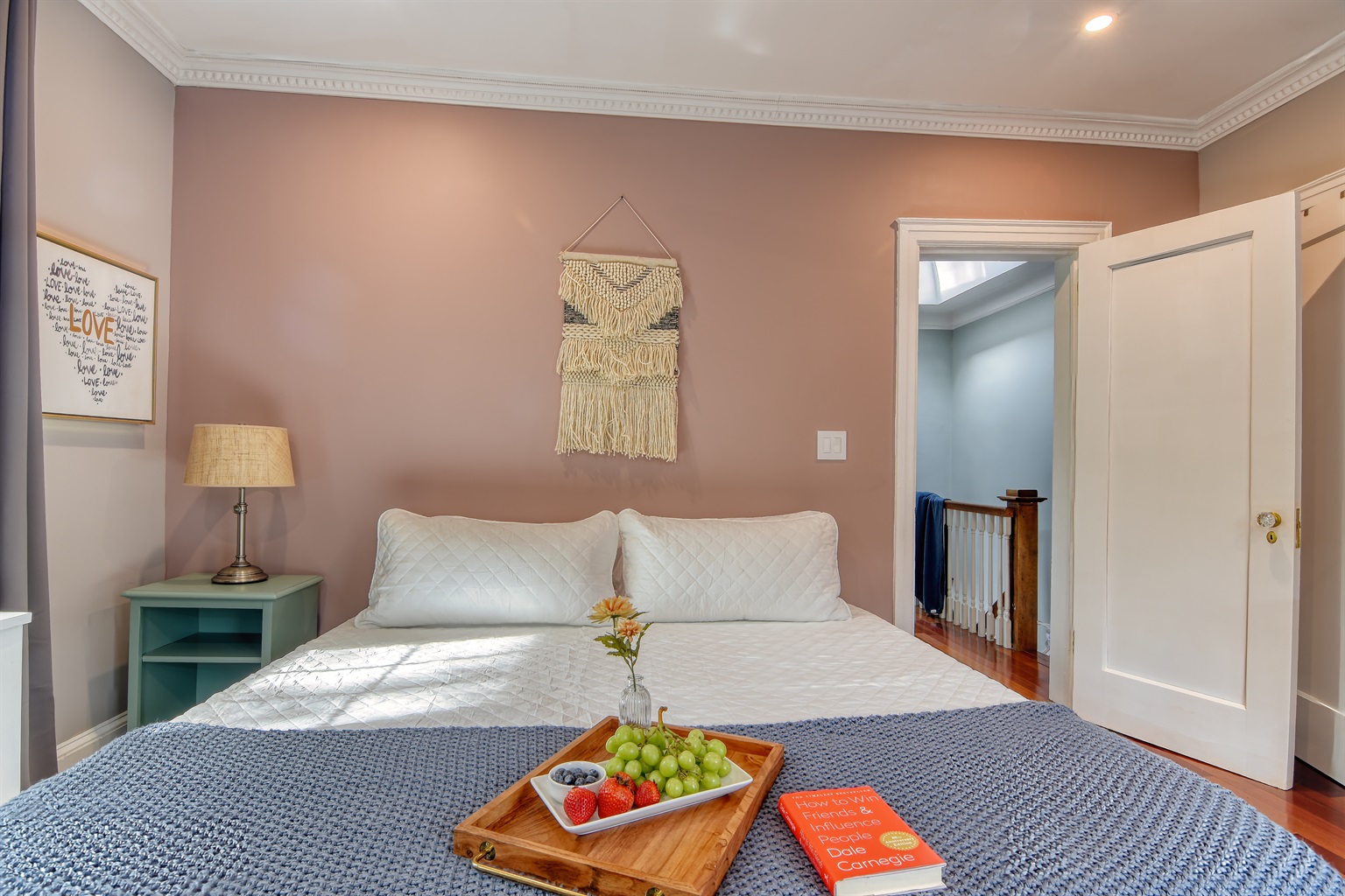 King Bed #2, 50" Tv, ceiling fan, windows providing lots of natural light.