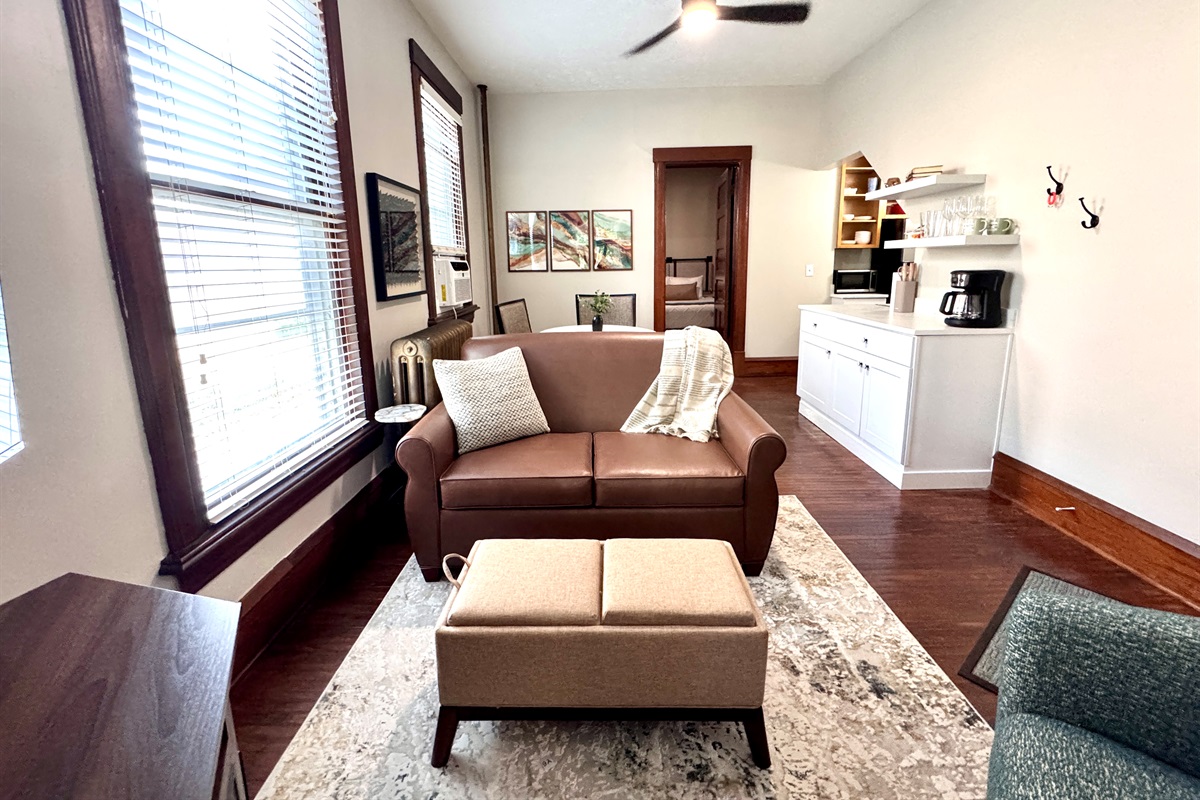Living room fit to spend hours relaxing, reading a book or watching a show on the 4K 50" smart TV.