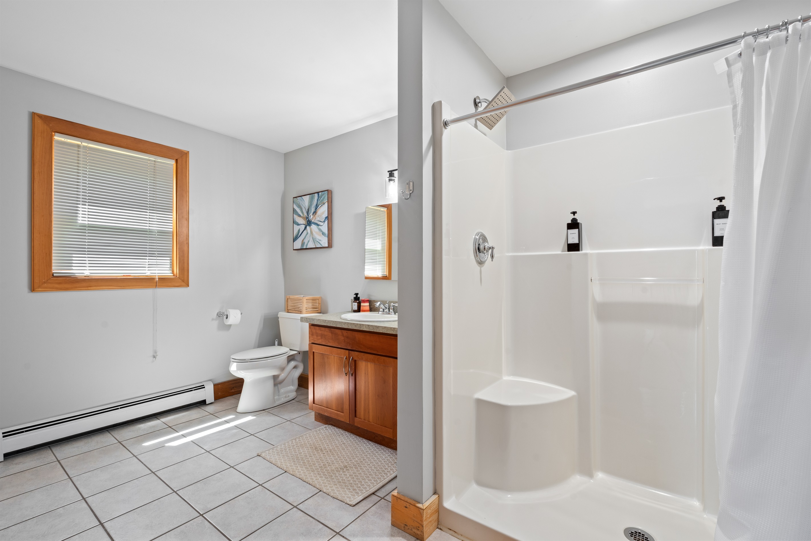 Move through your day with ease in a clean, spacious bathroom designed to handle group routines comfortably.