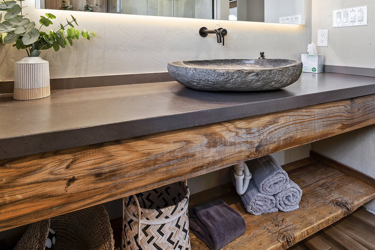 Full bath with vessel sink and plush towels, stocked for guests