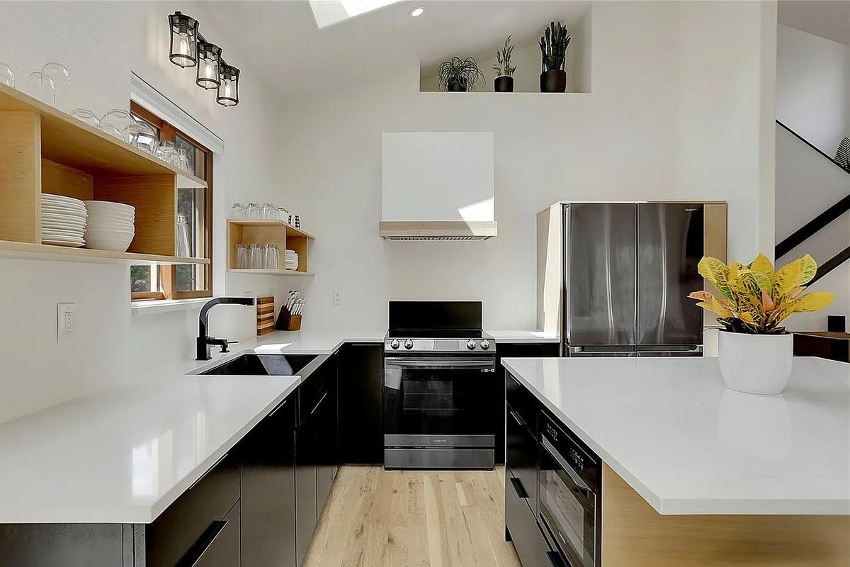 Seamlessly connected to the living area, this fully equipped kitchen and adjacent dining space make hosting effortless, whether you're whipping up a quick breakfast or settling in for a family dinner.