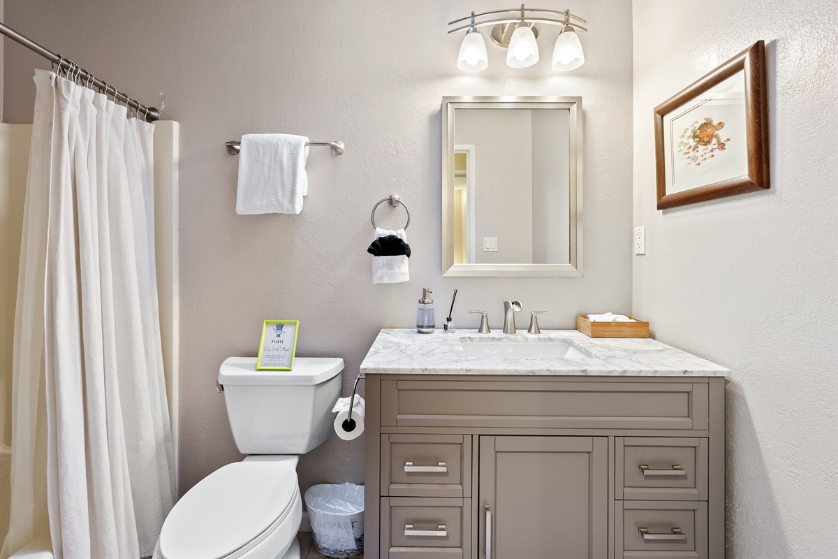 A sparkling clean bathroom stocked with essentials for a worry-free stay.