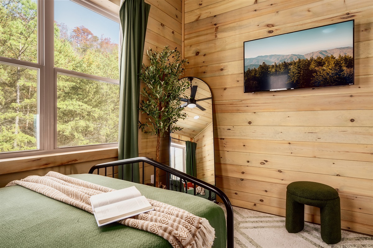 Mirror and TV placement that makes the room feel bigger and more comfortable.