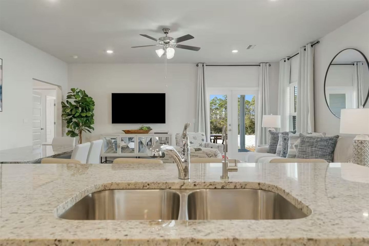 Full kitchen sink with the view of living area