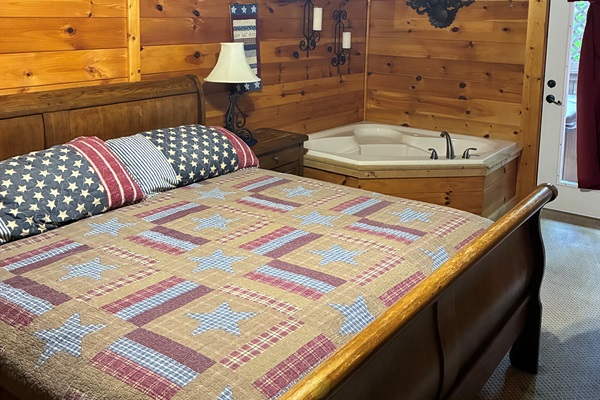 Bedroom lower level. Walk out to Hot-tub or use your private jacuzzi tub