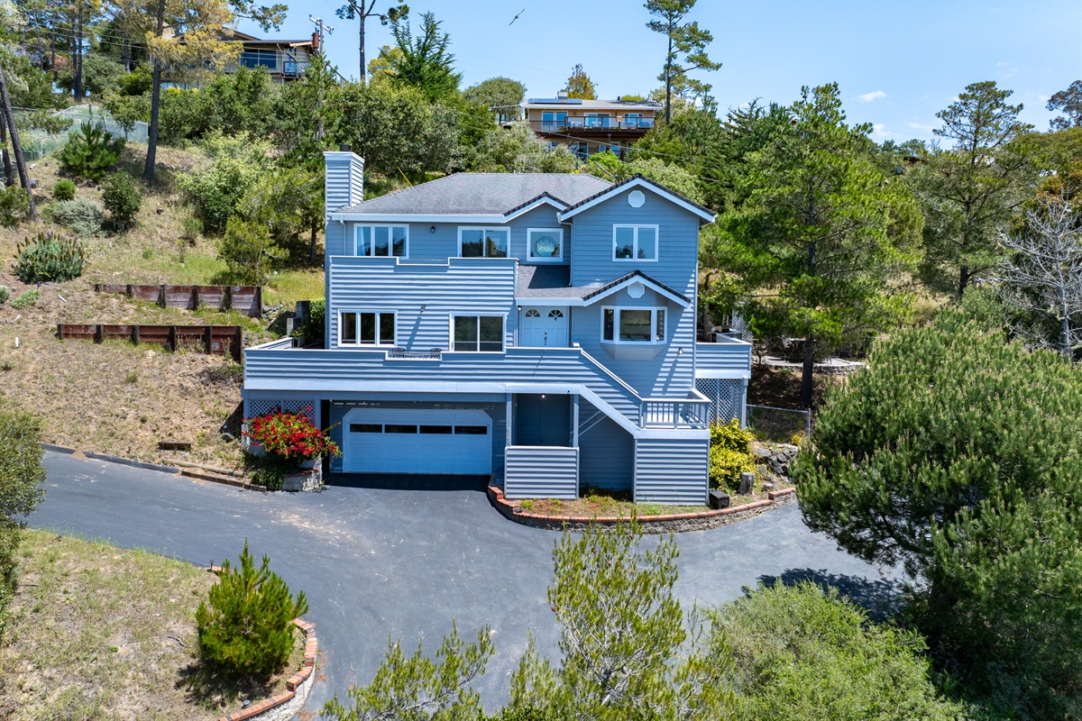 Updated split-level home with driveway and garage parking.