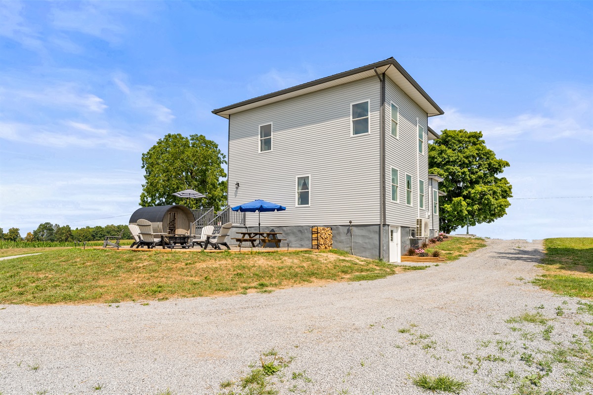 Easy access with a circular driveway, large outdoor area, and seamless indoor-outdoor living space.