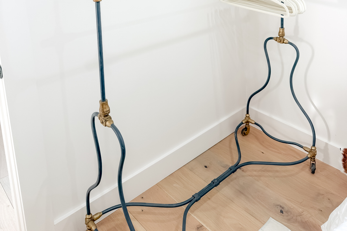 A vintage-style clothing hooks provide a convenient place to hang garments and accessories.