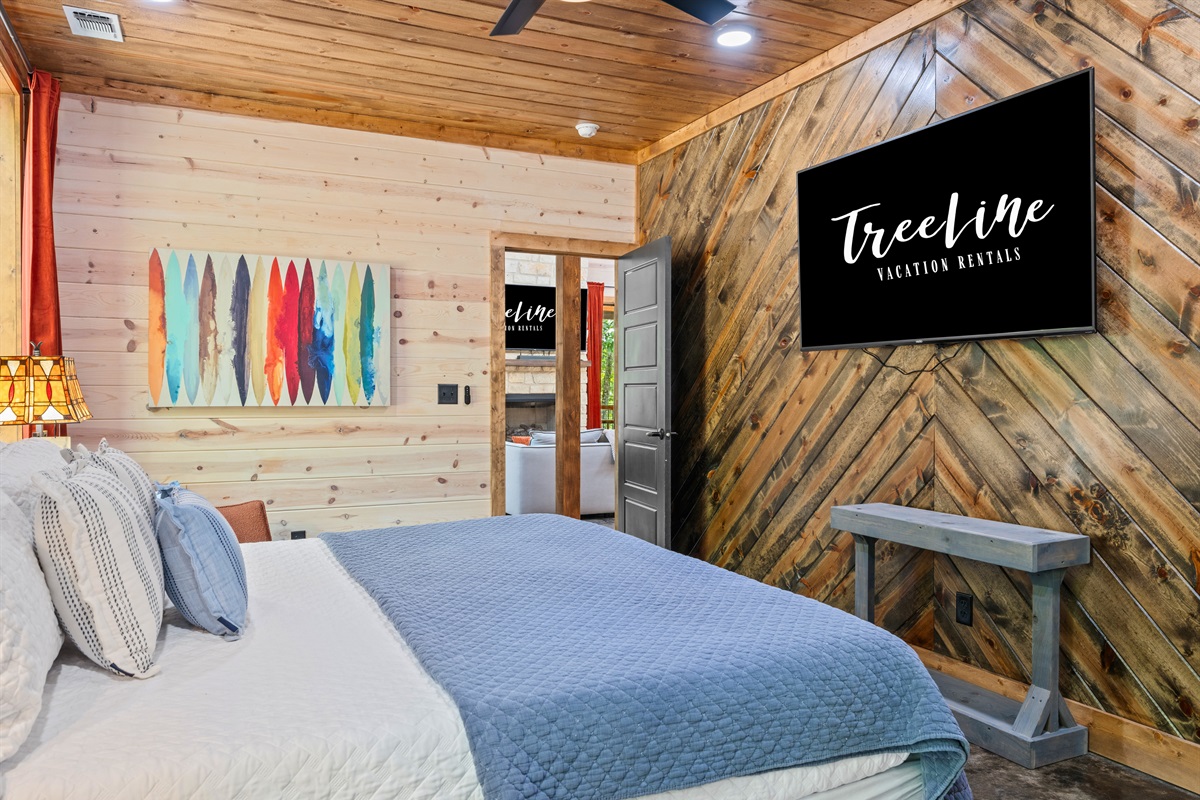 This bedroom also features a mounted TV - perfect for streaming your favorite show or movie.