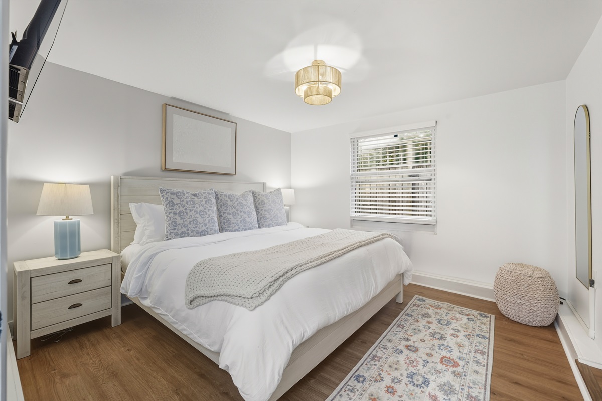 Converted garage bedroom with private access with coastal luxe details