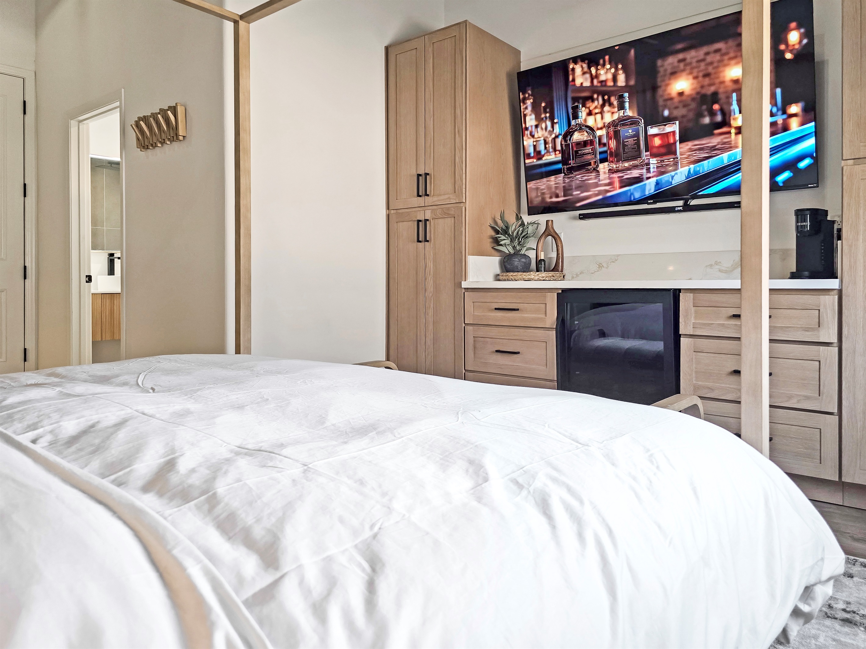 Beverage fridge, coffee maker and 75" smart tv with surround sound.