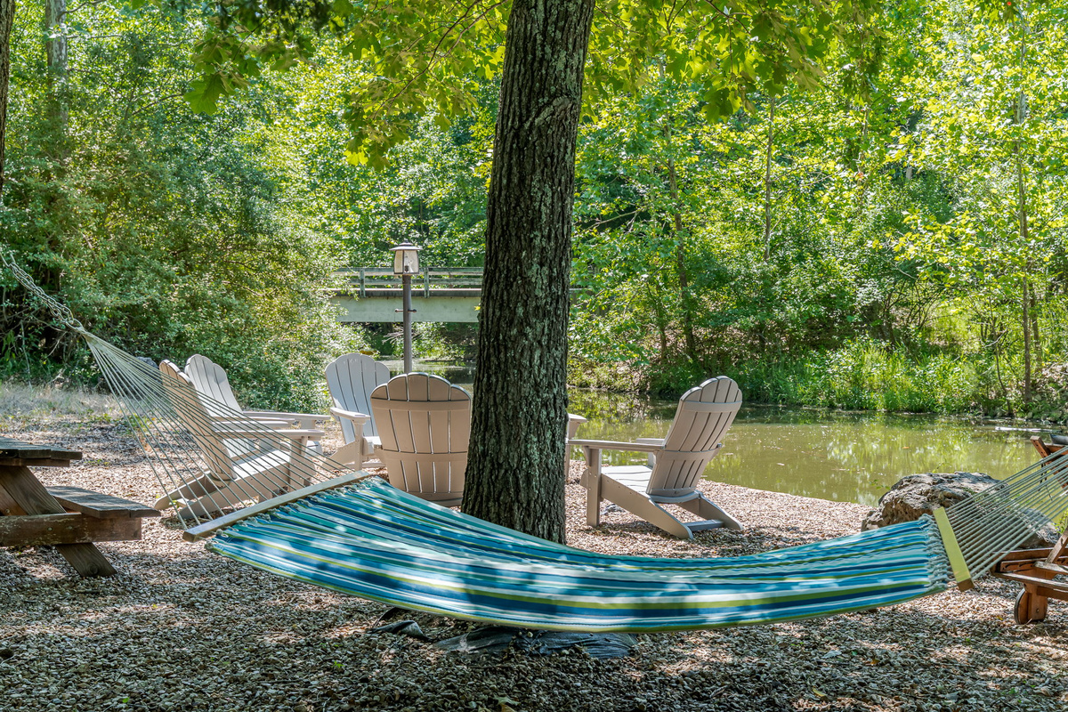 Pull a Adirondack chair up to the fire, hang in the hammock, or walk straight down to the dock — the whole lakefront is yours.