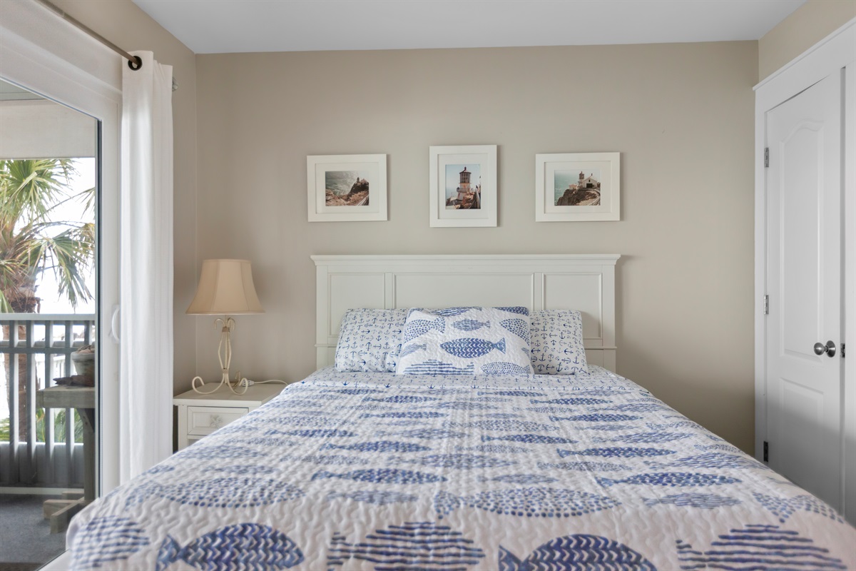 Spacious master bedroom with ocean views and balcony access - relax surrounded by light, coastal colors, and the calm of Cape San Blas