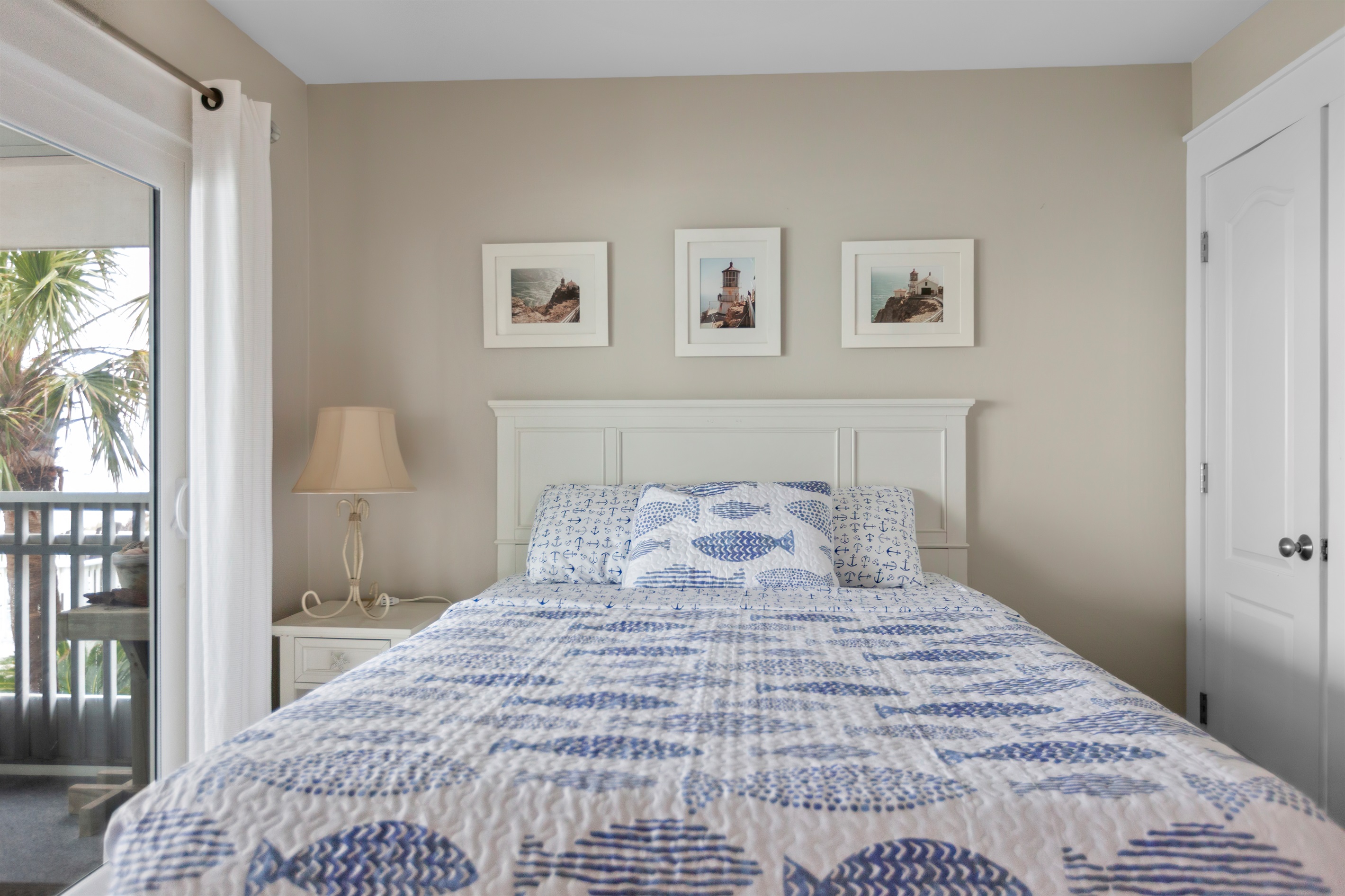 Spacious master bedroom with ocean views and balcony access - relax surrounded by light, coastal colors, and the calm of Cape San Blas