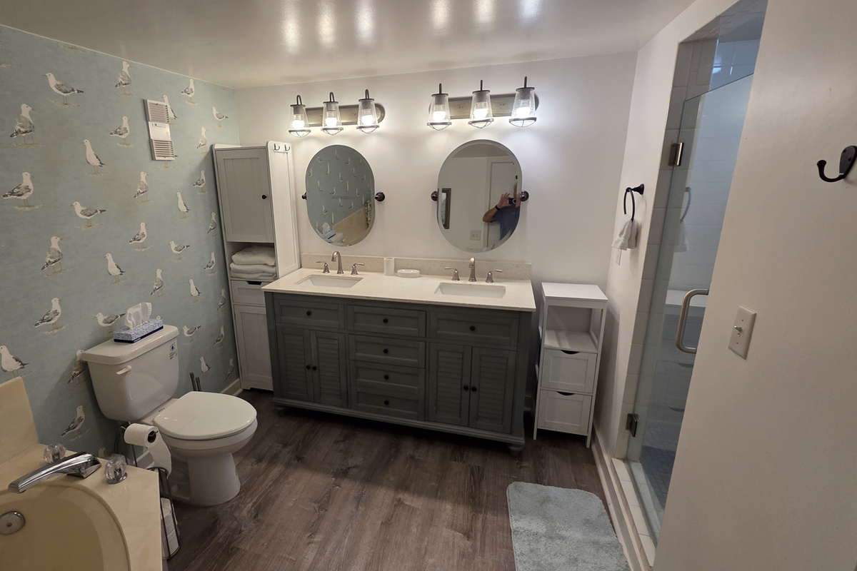 Master Bathroom with double sink, walk-in shower, and separate tub.
