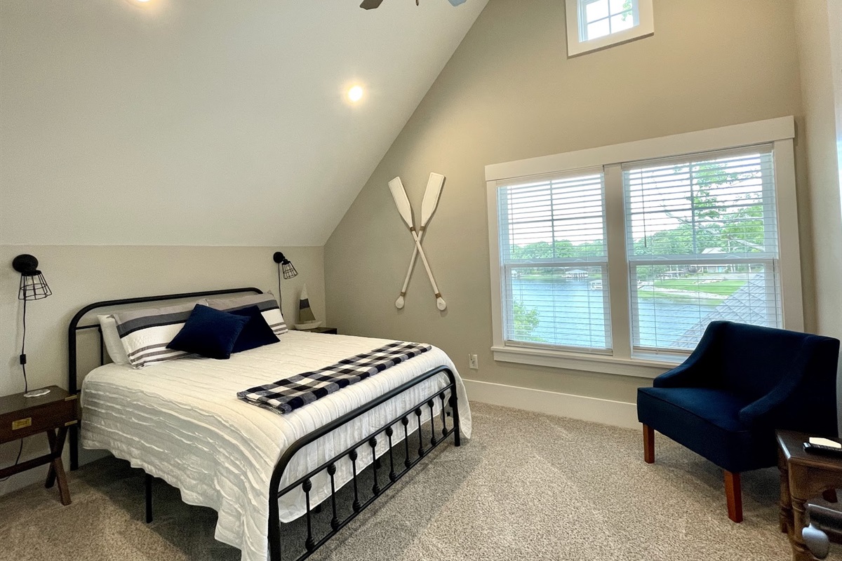 Upstairs lake-side room #3 has a queen bed and lake view
