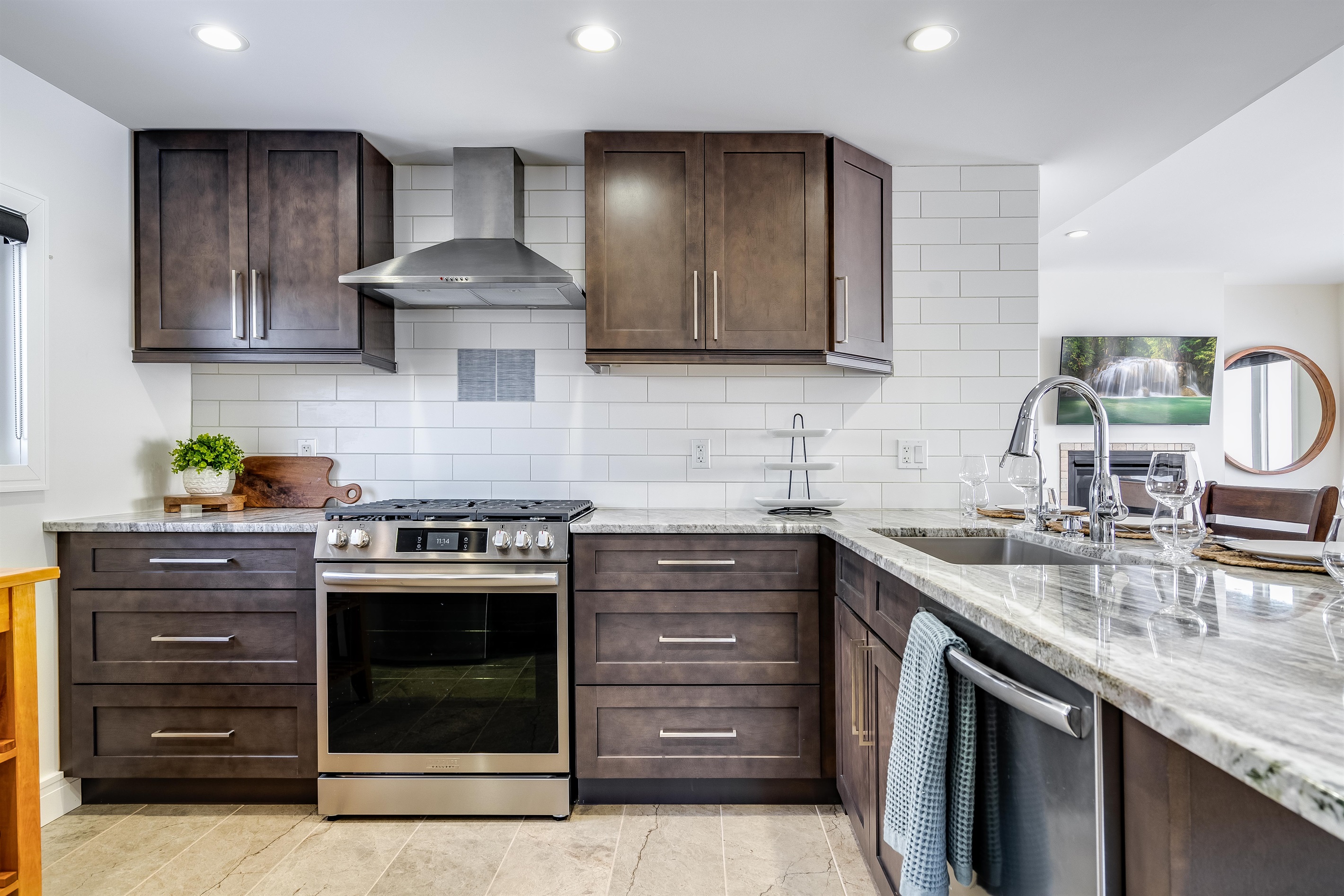 White quartz counters meet natural wood textures.
