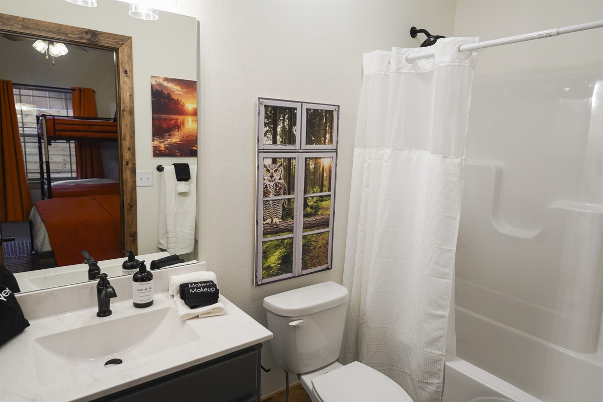 Attached ensuite bathroom with bath tub and shower