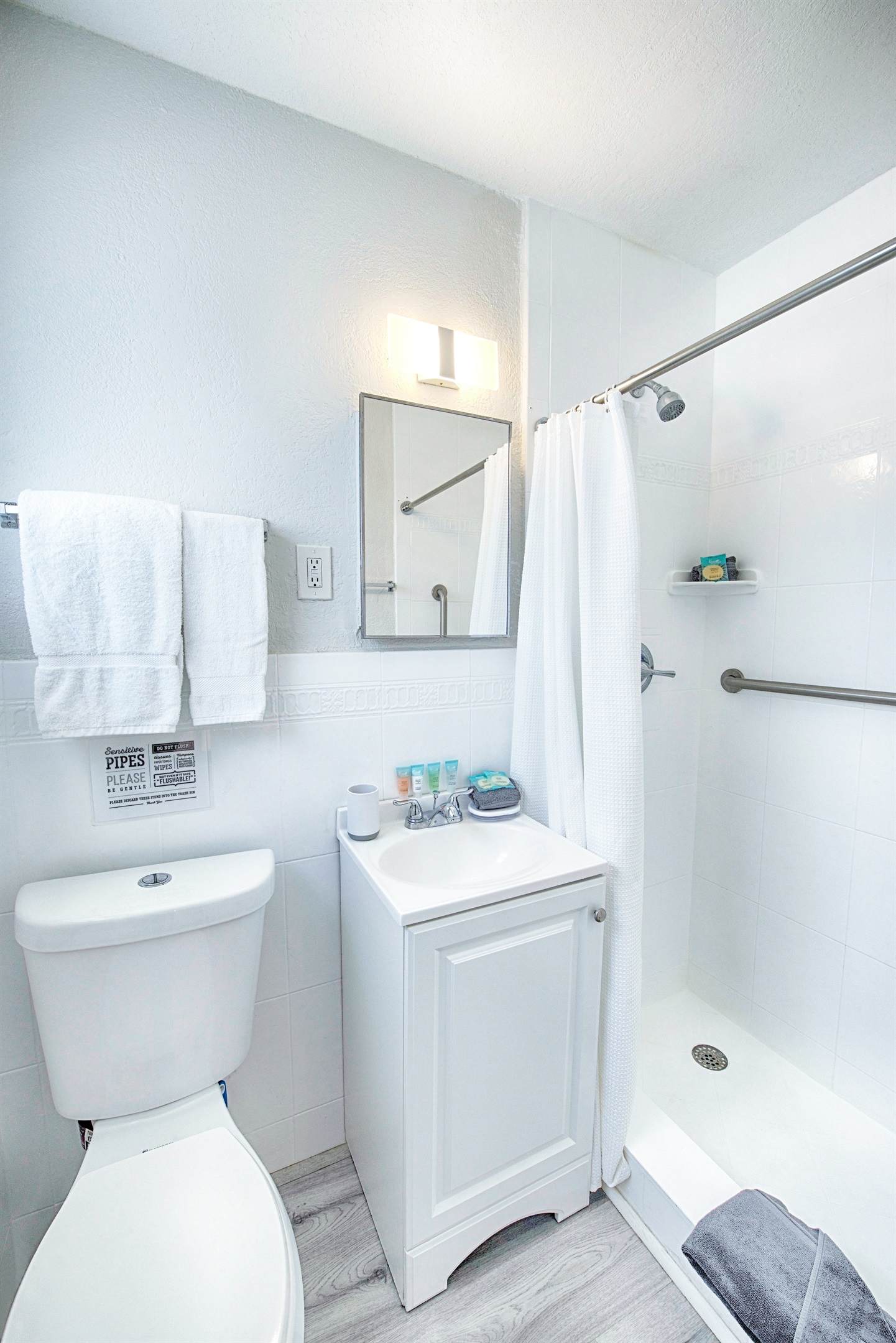 Private bathroom with vanity and shower stall